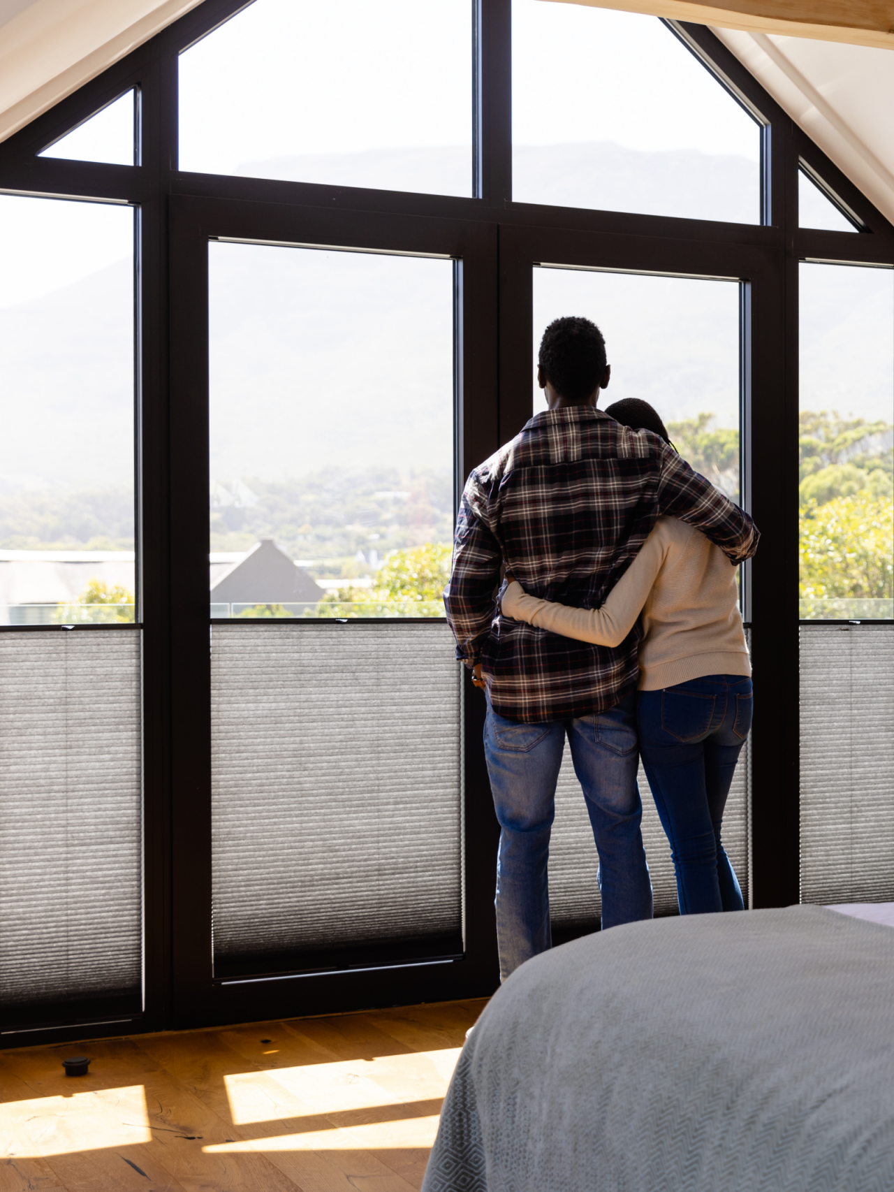 A couple enjoying their window treatments